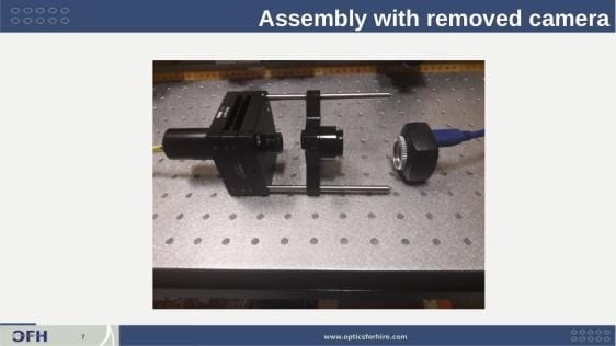 Assembled acceptance test fixture without camera mounted on half-inch post rods on optical breadboard